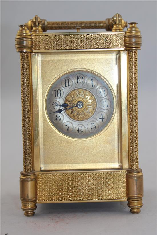 A late 19th century French ormolu hour repeating carriage clock, 7in., with travelling case